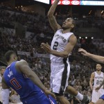 San Antonio Spurs' Kawhi Leonard (2) shoots over Los Angeles Clippers' Glen Davis (0) during the second half of Game 6 in an NBA basketball first-round playoff series, Thursday, April 30, 2015, in San Antonio. (AP Photo/Darren Abate)