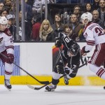  Los Angeles Kings forward Tanner Pearson (70) falls to the ice between Phoenix Coyotes forward Lauri Korpikoski (28) and defenseman Oliver Ekman-Larsson (23) during the second period of an NHL hockey game, Wednesday, April 2, 2014, in Los Angeles. (AP Photo/Ringo H.W. Chiu)