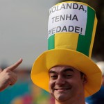 A Brazil soccer fan shows his hat with a sign written in Portuguese that reads "Netherlands have mercy", before the match between Brazil and the Netherlands that will decide the third place finish of the World Cup, outside the National Stadium in Brasilia, Brazil, Saturday, July 12, 2014. (AP Photo/Eraldo Peres)