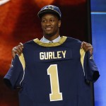 Georgia running back Todd Gurley poses for photos after being selected by the St. Louis Rams as the 10th pick in the first round of the 2015 NFL Draft, Thursday, April 30, 2015, in Chicago. (AP Photo/Charles Rex Arbogast)