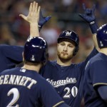  Milwaukee Brewers' Jonathan Lucroy (20) celebrates with teammates Lyle Overbay, left, Ryan Braun, right, and Scooter Gennett after Lucroy connected for a grand slam against the Arizona Diamondbacks during the seventh inning of a baseball game on Tuesday, June 17, 2014, in Phoenix. (AP Photo/Ross D. Franklin)