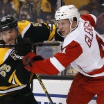 Boston Bruins defenseman Johnny Boychuk (55) collides with Detroit Red Wings' Luke Glendening during the first period of Game 2 of a first-round NHL hockey playoff series in Boston Sunday, April 20, 2014. (AP Photo/Winslow Townson)