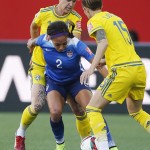 Sweden's Caroline Seger (17) and Therese Sjogran (15) go for the ball against United States' Sydney Leroux (2) during FIFA Women's World Cup soccer action in Winnipeg, Manitoba, Canada, Friday, June 12, 2015. (John Woods/The Canadian Press via AP)