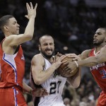 San Antonio Spurs' Manu Ginobili (20) is pressured by Los Angeles Clippers' Austin Rivers, left, and Chris Paul (3) during the second half of Game 3 in an NBA basketball first-round playoff series, Friday, April 24, 2015, in San Antonio. San Antonio won 100-73. (AP Photo/Darren Abate)