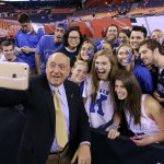 Broadcaster Dick Vitale poses for a photo with Duke fans before the NCAA Final Four college basketball tournament championship game between Wisconsin and Duke Monday, April 6, 2015, in Indianapolis. (AP Photo/David J. Phillip)