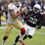 San Francisco 49ers quarterback Colin Kaepernick (7) is pursued by Arizona Cardinals free safety Tony Jefferson (22) during the second half of an NFL football game Sunday, Sept. 21, 2014, in Glendale, Ariz. (AP Photo/Ross D. Franklin)