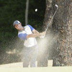 Rory McIlroy, of Northern Ireland, hits from the natural area on the fifth hole during the final round of the U.S. Open golf tournament in Pinehurst, N.C., Sunday, June 15, 2014. (AP Photo/Charlie Riedel)
