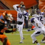 Washington quarterback Cyler Miles (10) throws against Oklahoma State during the first half of the Cactus Bowl NCAA college football game, Friday, Jan. 2, 2015, in Tempe, Ariz. (AP Photo/Rick Scuteri)
