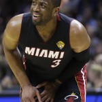  Miami Heat guard Dwyane Wade (3) reacts to a call by an official during the first half in Game 5 of the NBA basketball finals against the San Antonio Spurs on Sunday, June 15, 2014, in San Antonio. (AP Photo/David J. Phillip)