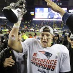 New England Patriots tight end Rob Gronkowski holds the championship trophy after the NFL football AFC Championship game Sunday, Jan. 18, 2015, in Foxborough, Mass. The Patriots defeated the Colts 45-7 to advance to the Super Bowl against the Seattle Seahawks. (AP Photo/Matt Slocum)
