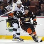  Los Angeles Kings center Jarret Stoll, left, and Anaheim Ducks defenseman Hampus Lindholm, of Sweden, battle for the puck during the first period in Game 2 of an NHL hockey second-round Stanley Cup playoff series, Monday, May 5, 2014, in Anaheim, Calif. (AP Photo/Mark J. Terrill)