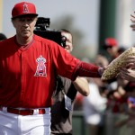 Actor Will Ferrell arrives dressed as a Los Angeles Angels during a spring training baseball exhibition game against the Chicago Cubs in Tempe, Ariz., on Thursday, March 12, 2015. The comedian plans to play every position while making appearances at five Arizona spring training games on Thursday. (AP Photo/Chris Carlson)