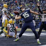 Seattle Seahawks' Jermaine Kearse celebrates after catching the game-winning touchdown during overtime of the NFL football NFC Championship game against the Green Bay Packers Sunday, Jan. 18, 2015, in Seattle. The Seahawks won 28-22 to advance to Super Bowl XLIX. (AP Photo/Jeff Chiu)