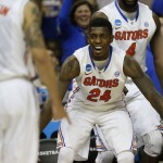 Florida forward Casey Prather (24) celebrates a three-point shot against UCLA during the second half in a regional semifinal game at the NCAA college basketball tournament, Thursday, March 27, 2014, in Memphis, Tenn. Florida won 79-68. (AP Photo/John Bazemore)