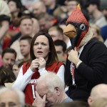 Louisville fans watch during the first half of a regional final against Michigan State in the NCAA men's college basketball tournament Sunday, March 29, 2015, in Syracuse, N.Y. (AP Photo/Heather Ainsworth)