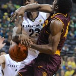 Arizona State's Shaquielle McKissic, right, is fouled by Oregon's Elgin Cook during the first half of an NCAA college basketball game in Corvallis, Ore., Saturday, Jan. 10, 2015. (AP Photo/Greg Wahl-Stephens)