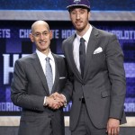 NBA Commissioner Adam Silver poses for a photo with Frank Kaminsky after Kaminsky was selected ninth overall by the Charlotte Hornets during the NBA basketball draft, Thursday, June 25, 2015, in New York. (AP Photo/Kathy Willens)
