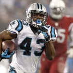 Carolina Panthers' Fozzy Whittaker (43) runs for a touchdown against the Arizona Cardinals in the second half of an NFL wild card playoff football game in Charlotte, N.C., Saturday, Jan. 3, 2015. (AP Photo/Bob Leverone)