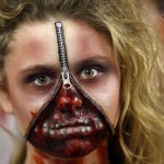 A member of the Dallas Cowboys cheerleaders dressed in a zombie costume performs at halftime of an NFL football game against the Washington Redskins, Monday, Oct. 27, 2014, in Arlington, Texas. (AP Photo/Tim Sharp)