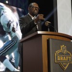 Former Seattle Seahawks safety Kenny Easley announces that the Seahawks selects Michigan defensive lineman Frank Clark as the 63rd pick in the second round of the 2015 NFL Football Draft, Friday, May 1, 2015, in Chicago. (AP Photo/Charles Rex Arbogast)