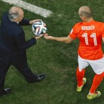 Netherlands' Arjen Robben (11) is given the ball by Argentina's head coach Alejandro Sabella during the World Cup semifinal soccer match between the Netherlands and Argentina at the Itaquerao Stadium in Sao Paulo, Brazil, Wednesday, July 9, 2014. (AP Photo/Fabrizio Bensch, Pool)
