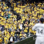 Seattle Mariners' fans seated in the "King's Court" cheer starting pitcher Felix Hernandez (34) on his first strikeout, of Los Angeles Angels lead off hitter Kole Calhoun in the first inning of a baseball game Monday, April 6, 2015, in Seattle. (AP Photo/Elaine Thompson)