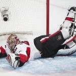 Ottawa Senators goaltender Craig Anderson makes a save against the Montreal Canadiens during the second period of Game 5 of a first-round NHL hockey playoff series, Friday, April 24, 2015, in Montreal. (Graham Hughes/The Canadian Press via AP)