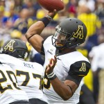 Appalachian State quarterback Kameron Bryant (5) throws a pass in the first quarter of an NCAA college football game against Michigan in Ann Arbor, Mich., Saturday, Aug. 30, 2014. (AP Photo/Tony Ding)
