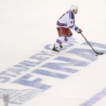  New York Rangers defenseman Raphael Diaz skates past the Stanley Cup logo during the first period in Game 1 of the NHL hockey Stanley Cup Finals against the Los Angeles Kings, Wednesday, June 4, 2014, in Los Angeles. (AP Photo/Mark J. Terrill)