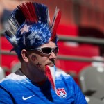 A U.S. fan watches as the team warms up for a FIFA Women's World Cup soccer game between Nigeria and the United States, Tuesday, June 16, 2105, in Vancouver, British Columbia, Canada. (Darryl Dyck/The Canadian Press via AP)
