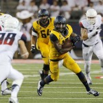 California wide receiver Darius Powe (10) runs with the ball after a reception against Arizona during the first half of an NCAA college football game, Saturday, Sept. 20, 2014, in Tucson, Ariz. (AP Photo/Rick Scuteri)
