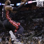  Miami Heat forward LeBron James shoots against the San Antonio Spurs during the first half in Game 5 of the NBA basketball finals on Sunday, June 15, 2014, in San Antonio. (AP Photo/David J. Phillip)