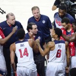 United States' coach Mike Krzyzewski, center, is surrounded by his players during the final World Basketball match between the United States and Serbia at the Palacio de los Deportes stadium in Madrid, Spain, Sunday, Sept. 14, 2014. (AP Photo/Manu Fernandez)