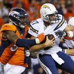San Diego Chargers quarterback Philip Rivers (17) is sacked by Denver Broncos outside linebacker Von Miller (58) during the first half of an NFL football game, Thursday, Oct. 23, 2014, in Denver. (AP Photo/Jack Dempsey)
