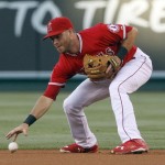 Los Angeles Angels second baseman Taylor Featherston retrieves the ball after fielding a ground ball by Arizona Diamondbacks' Paul Goldschmidt during the first inning of a baseball game in Anaheim, Calif., Tuesday, June 16, 2015. Featherston was charged with an error. (AP Photo/Alex Gallardo)
