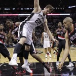 San Antonio Spurs' Tiago Splitter (22), of Brazil, loses control of the ball as Portland Trail Blazers' LaMarcus Aldridge, second from left, and Nicolas Batum (88) pressure him during the second half of Game 2 of a Western Conference semifinal NBA basketball playoff series, Thursday, May 8, 2014, in San Antonio. San Antonio won 114-97. (AP Photo/Eric Gay)