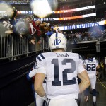Indianapolis Colts quarterback Andrew Luck walks to his locker room after the NFL football AFC Championship game against the New England Patriots Sunday, Jan. 18, 2015, in Foxborough, Mass. The Patriots defeated the Colts 45-7 to advance to the Super Bowl against the Seattle Seahawks. (AP Photo/Julio Cortez)