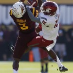 Arizona State's Damarious Randall (3) intercepts a pass intended for Washington State's Robert Lewis (15) during the first half of an NCAA college football game, Saturday, Nov. 22, 2014, in Tempe, Ariz. (AP Photo/Ross D. Franklin)