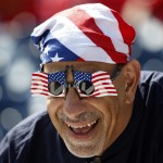 George Hyder, from Annandale, Va., wears patriotic attire before a baseball game between the Washington Nationals and the Chicago Cubs at Nationals Park, Friday, July 4, 2014, in Washington. (AP Photo/Alex Brandon)