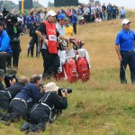 Francesco Molinari of Italy prepares to play his shot on the 11th fairway as photographers lie in wait for the shot during the third day of the British Open Golf championship at the Royal Liverpool golf club, Hoylake, England, Saturday July 19, 2014. (AP Photo/Jon Super)