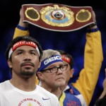 Manny Pacquiao, from the Philippines, gets ready before the welterweight title fight against Floyd Mayweather Jr., on Saturday, May 2, 2015 in Las Vegas. (AP Photo/Isaac Brekken)