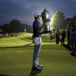 Rory McIlroy, of Northern Ireland, holds up the Wanamaker Trophy after winning the PGA Championship golf tournament at Valhalla Golf Club on Sunday, Aug. 10, 2014, in Louisville, Ky. (AP Photo/John Locher)