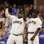 San Francisco Giants Pablo Sandoval reacts after hitting a single during the eighth inning of Game 5 of baseball's World Series against the Kansas City Royals Sunday, Oct. 26, 2014, in San Francisco. Right is first base coach Roberto Kelly. (AP Photo/Matt Slocum)