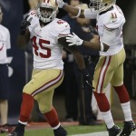 San Francisco 49ers' Asante Cleveland (45) celebrates with teammate Quinton Patton (11) after he scored a touchdown against the Houston Texans during the second quarter of an NFL football preseason game Thursday, Aug. 28, 2014, in Houston. (AP Photo/David J. Phillip)