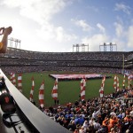 A fan takes a picture during the national anthem before Game 4 of baseball's World Series between the Kansas City Royals and the San Francisco Giants Saturday, Oct. 25, 2014, in San Francisco. (AP Photo/Charlie Riedel)