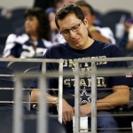 A Dallas Cowboys fan pauses in the stands after an NFL football game between the Cowboys and the Washington Redskins, Monday, Oct. 27, 2014, in Arlington, Texas. Washington won 20-17. (AP Photo/Tim Sharp)