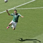  Mexico's Oribe Peralta jumps for a ball during the World Cup round of 16 soccer match between the Netherlands and Mexico at the Arena Castelao in Fortaleza, Brazil, Sunday, June 29, 2014. (AP Photo/Themba Hadebe)