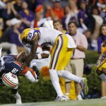 Auburn wide receiver Sammie Coates (18) falls to the turf with a touchdown reception against LSU defensive back Rashard Robinson (21) during the first half of an NCAA college football game Saturday, Oct. 4, 2014, in Auburn, Ala. (AP Photo/Brynn Anderson)