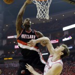 Portland Trail Blazers' Thomas Robinson tries to shoot past Houston Rockets' Omer Asik during the first half in Game 1 of an opening-round NBA basketball playoff series, Sunday, April 20, 2014, in Houston. (AP Photo/David J. Phillip)