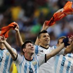  Argentina's Lionel Messi and teammates celebrate at the end of the World Cup quarterfinal soccer match between Argentina and Belgium at the Estadio Nacional in Brasilia, Brazil, Saturday, July 5, 2014. Argentina won 1-0. (AP Photo/Eraldo Peres)